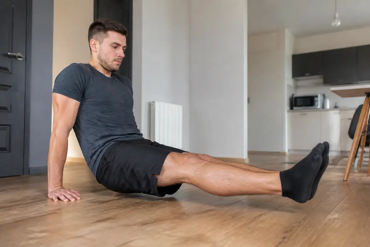 Leg extension sans machine : exercices et alternatives efficaces